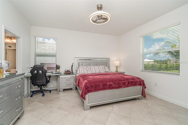 24348 Nicobar Ln, Punta Gorda, FL 33955 - bedroom with multiple windows, an office area, and light tile patterned flooring