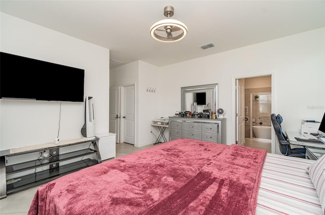 24348 Nicobar Ln, Punta Gorda, FL 33955 - bedroom featuring light tile patterned floors and ensuite bath