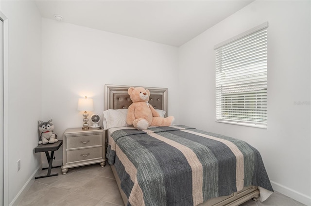 24348 Nicobar Ln, Punta Gorda, FL 33955 - tiled bedroom featuring baseboards