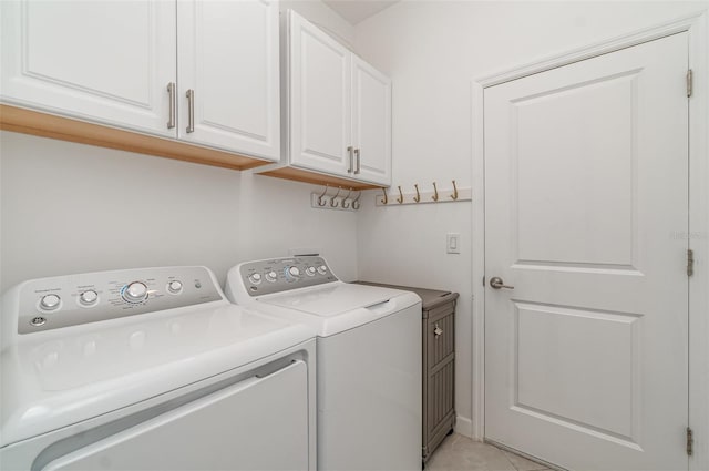 24348 Nicobar Ln, Punta Gorda, FL 33955 - laundry area with separate washer and dryer, cabinet space, and light tile patterned floors