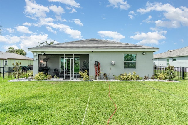 24348 Nicobar Ln, Punta Gorda, FL 33955 - rear view of property with stucco siding and a sunroom