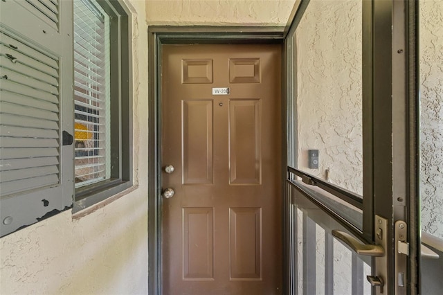 19505 Quesada Ave Unit Vv201, Port Charlotte, FL 33948 - doorway to property featuring stucco siding