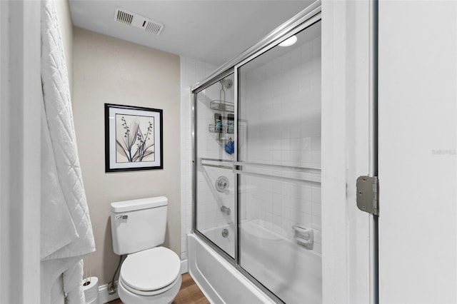 19505 Quesada Ave Unit Vv201, Port Charlotte, FL 33948 - bathroom with shower / bath combination with glass door and wood finished floors