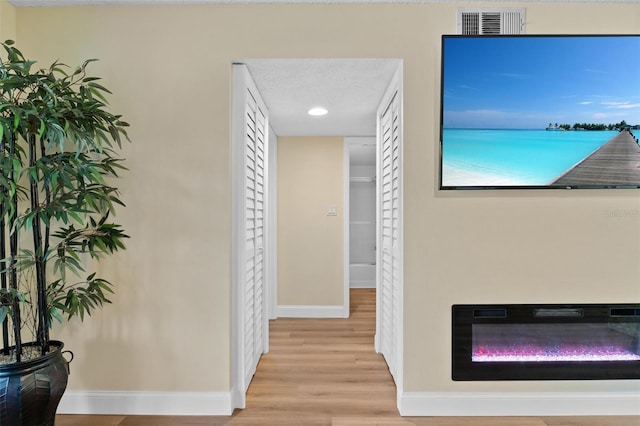 19505 Quesada Ave Unit Vv201, Port Charlotte, FL 33948 - hallway with baseboards and wood finished floors
