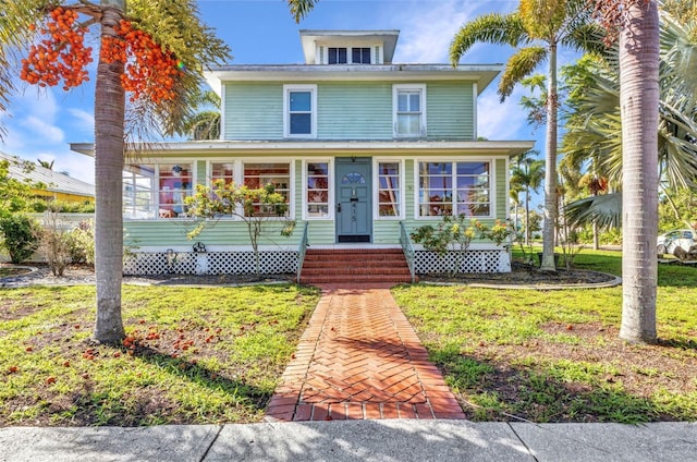 415 W Marion Ave, Punta Gorda, FL 33950 - traditional style home featuring a front yard