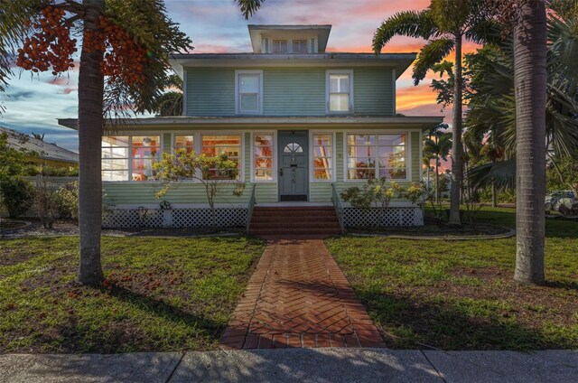 415 W Marion Ave, Punta Gorda, FL 33950 - traditional style home featuring a yard