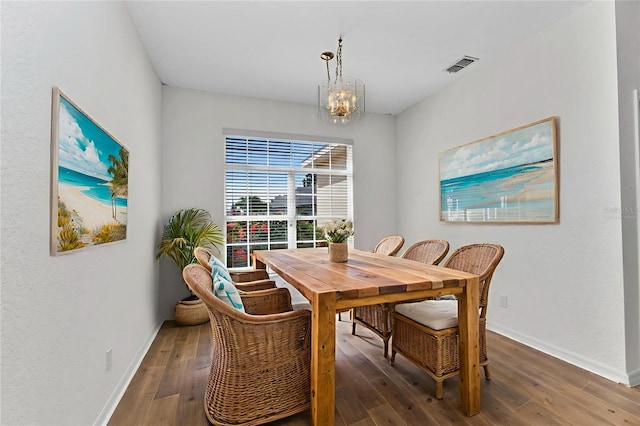 1605 Palace Ct, Punta Gorda, FL 33980 - dining space featuring wood finished floors and a chandelier