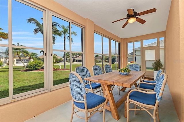 1605 Palace Ct, Punta Gorda, FL 33980 - sunroom featuring concrete flooring, a textured wall, and a residential view