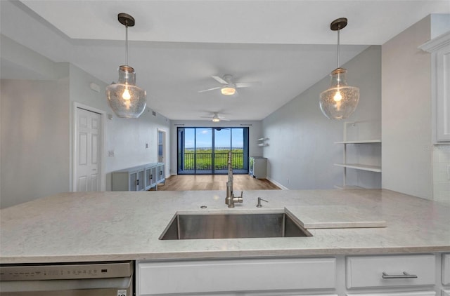 900 E Marion Ave Unit 1203, Punta Gorda, FL 33950 - kitchen with dishwashing machine, white cabinetry, ceiling fan, and hanging light fixtures