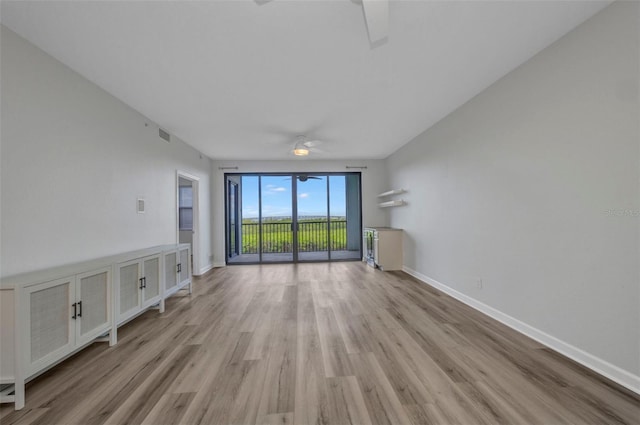 900 E Marion Ave Unit 1203, Punta Gorda, FL 33950 - unfurnished living room with a ceiling fan and light wood-style flooring