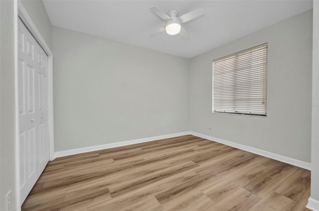 900 E Marion Ave Unit 1203, Punta Gorda, FL 33950 - unfurnished bedroom featuring a closet, light wood-type flooring, and a ceiling fan