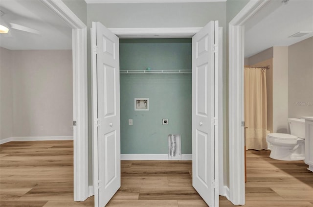 900 E Marion Ave Unit 1203, Punta Gorda, FL 33950 - laundry room featuring hookup for an electric dryer, hookup for a washing machine, a ceiling fan, and light wood-style flooring