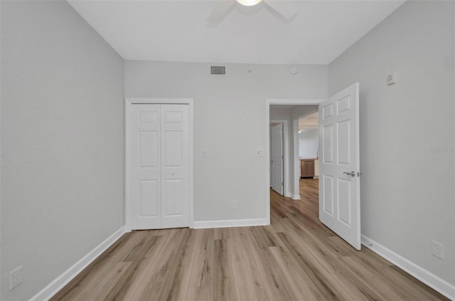 900 E Marion Ave Unit 1203, Punta Gorda, FL 33950 - unfurnished bedroom featuring light wood-type flooring, a closet, and ceiling fan