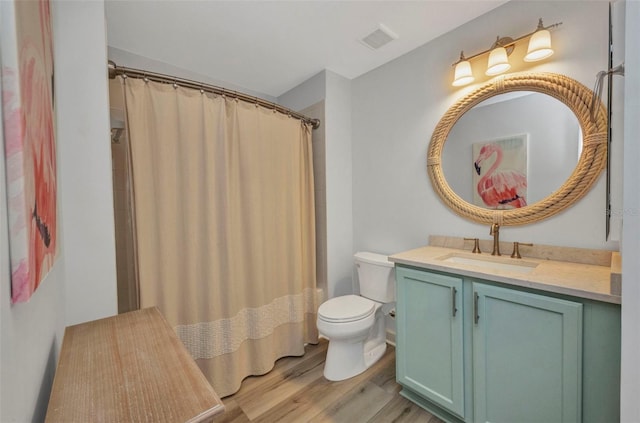 900 E Marion Ave Unit 1203, Punta Gorda, FL 33950 - bathroom featuring wood finished floors, vanity, and curtained shower
