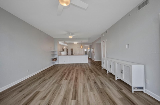 900 E Marion Ave Unit 1203, Punta Gorda, FL 33950 - unfurnished living room with a ceiling fan and wood finished floors