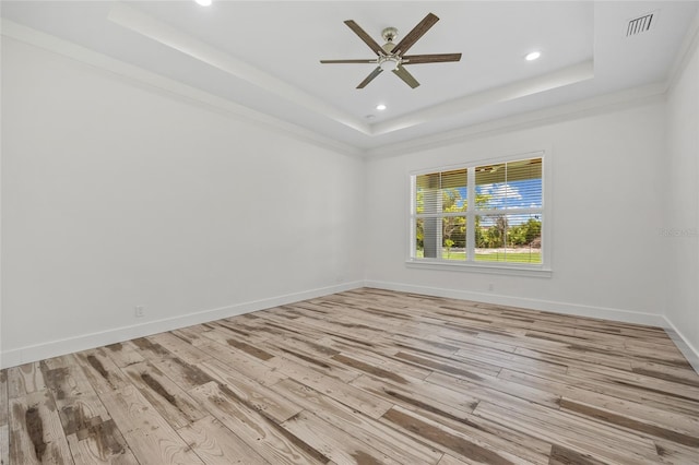 28960 Gin Ln, Punta Gorda, FL 33982 - unfurnished room with a tray ceiling, a ceiling fan, light wood-type flooring, and recessed lighting