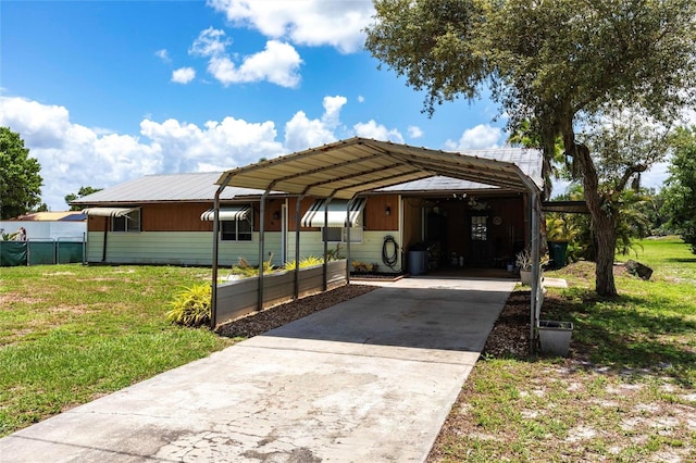 8513 Heister St, Punta Gorda, FL 33982 - view of car parking featuring concrete driveway and a carport