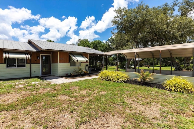 8513 Heister St, Punta Gorda, FL 33982 - view of grassy yard with a carport