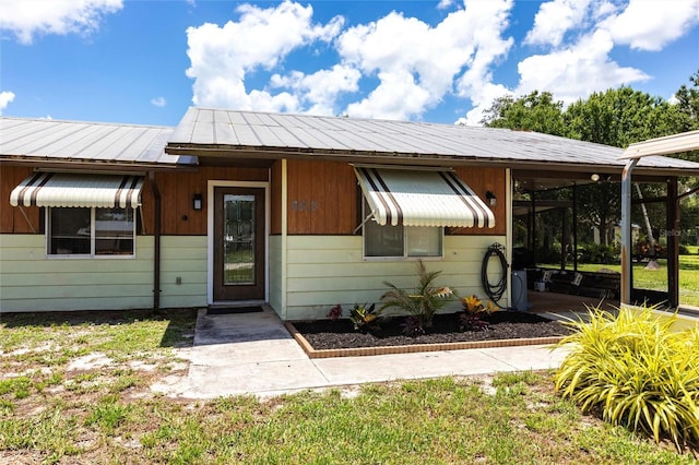 8513 Heister St, Punta Gorda, FL 33982 - view of front of house with a metal roof