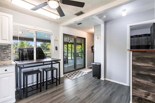 8513 Heister St, Punta Gorda, FL 33982 - dining space featuring ceiling fan and dark wood-style floors