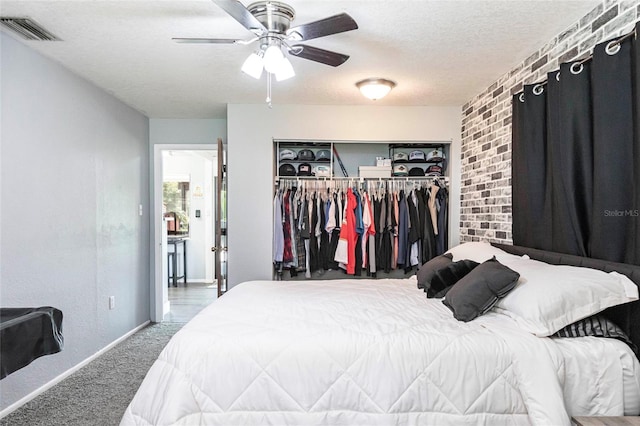 8513 Heister St, Punta Gorda, FL 33982 - carpeted bedroom featuring a closet, a textured ceiling, and a ceiling fan