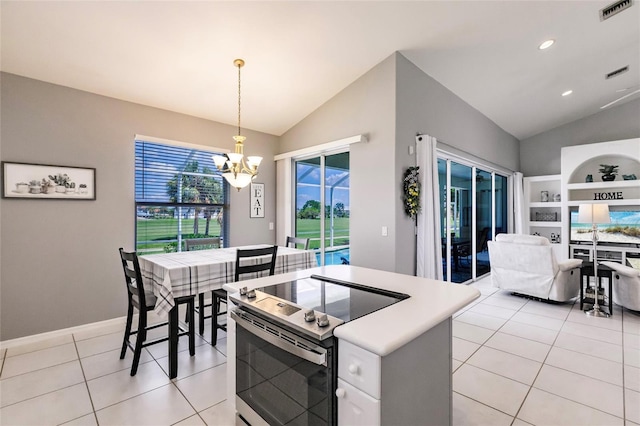 2105 Deborah Dr, Punta Gorda, FL 33950 - kitchen featuring vaulted ceiling, electric stove, a chandelier, light tile patterned flooring, and pendant lighting
