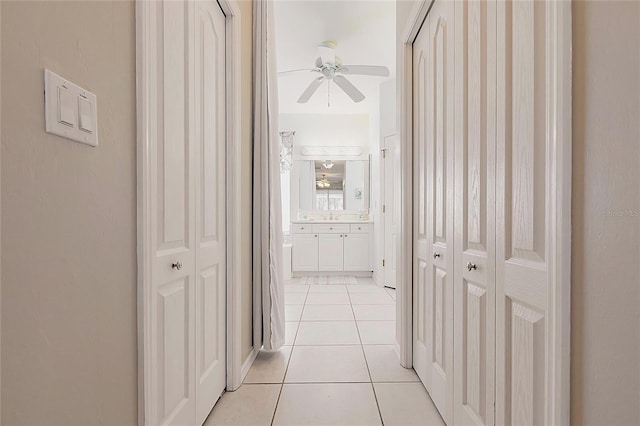 2105 Deborah Dr, Punta Gorda, FL 33950 - hallway with light tile patterned flooring and a sink