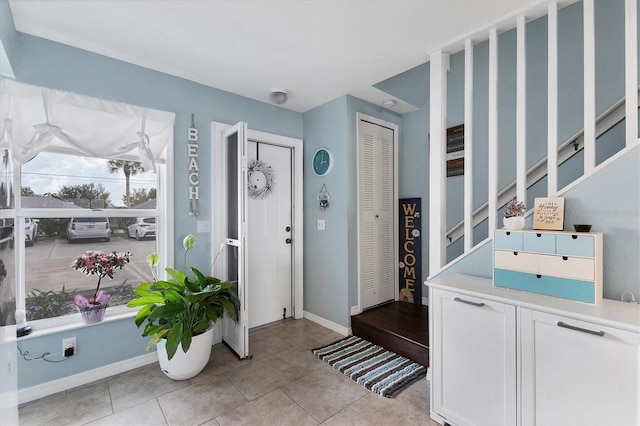 26310 Rampart Blvd Unit 504, Punta Gorda, FL 33983 - entryway featuring stairs and light tile patterned flooring