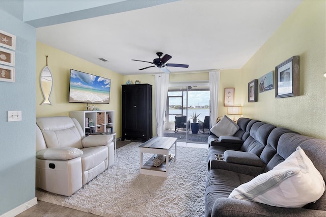 26310 Rampart Blvd Unit 504, Punta Gorda, FL 33983 - living area featuring a ceiling fan and a textured wall