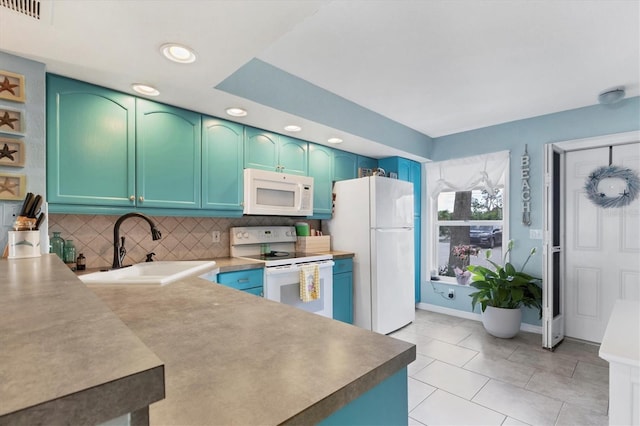 26310 Rampart Blvd Unit 504, Punta Gorda, FL 33983 - kitchen featuring white appliances, tasteful backsplash, recessed lighting, and light tile patterned flooring