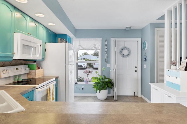 26310 Rampart Blvd Unit 504, Punta Gorda, FL 33983 - kitchen featuring white appliances, decorative backsplash, light countertops, recessed lighting, and light tile patterned floors