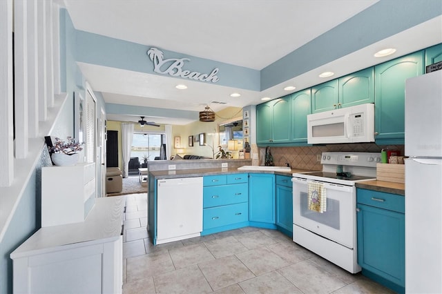 26310 Rampart Blvd Unit 504, Punta Gorda, FL 33983 - kitchen featuring white appliances, a peninsula, open floor plan, recessed lighting, and backsplash