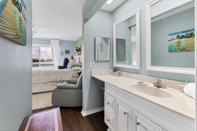 26310 Rampart Blvd Unit 504, Punta Gorda, FL 33983 - ensuite bathroom with wood finished floors, vanity, and ceiling fan