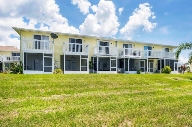 26310 Rampart Blvd Unit 504, Punta Gorda, FL 33983 - back of house with a sunroom and a lawn