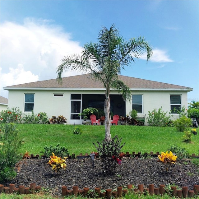 25224 Lahore Ln, Punta Gorda, FL 33983 - view of front of home with stucco siding and a front lawn