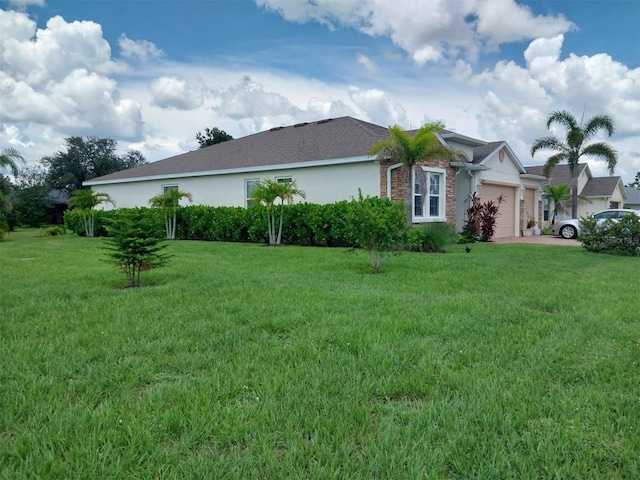 25224 Lahore Ln, Punta Gorda, FL 33983 - view of home's exterior featuring stucco siding, an attached garage, and a yard