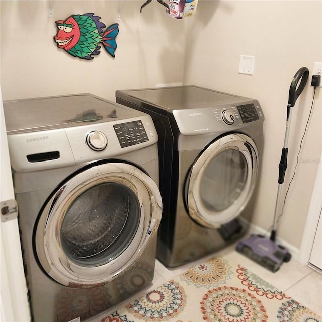 25224 Lahore Ln, Punta Gorda, FL 33983 - laundry area with washer and clothes dryer and tile patterned flooring