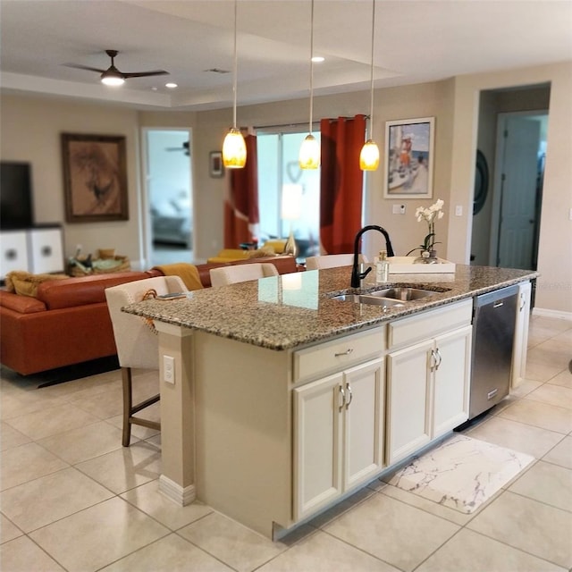 25224 Lahore Ln, Punta Gorda, FL 33983 - kitchen with dishwasher, a kitchen island with sink, open floor plan, light stone countertops, and pendant lighting