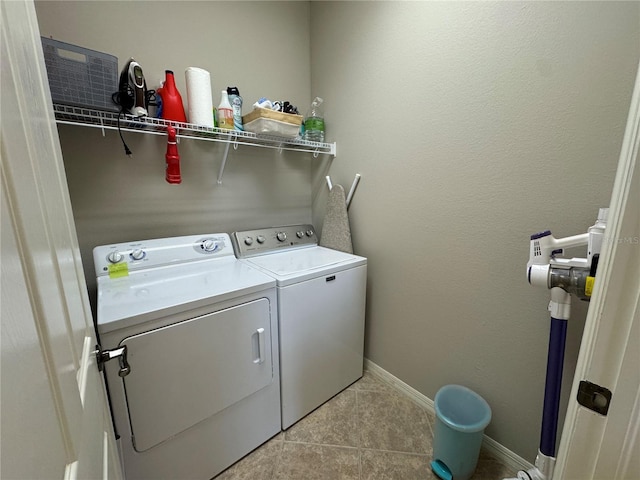 11220 Paseo Grande Blvd Unit 5207, Fort Myers, FL 33912 - washroom featuring washer and clothes dryer and light tile patterned floors