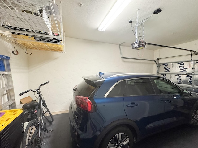 11220 Paseo Grande Blvd Unit 5207, Fort Myers, FL 33912 - garage with a garage door opener and a textured wall