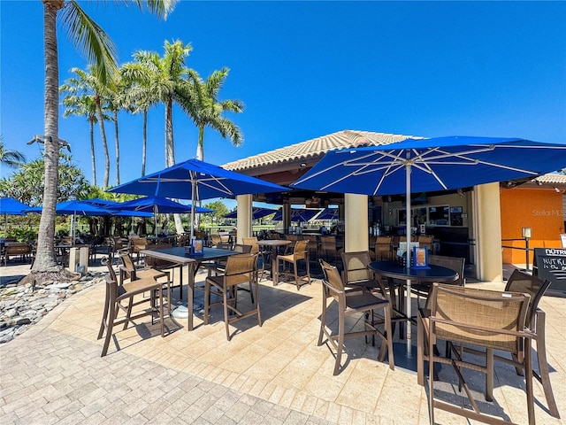 11220 Paseo Grande Blvd Unit 5207, Fort Myers, FL 33912 - view of patio featuring outdoor dining area