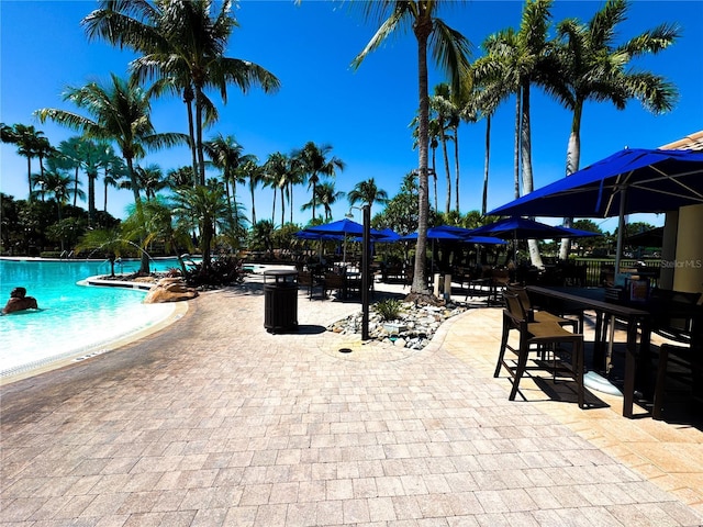 11220 Paseo Grande Blvd Unit 5207, Fort Myers, FL 33912 - community pool with a patio