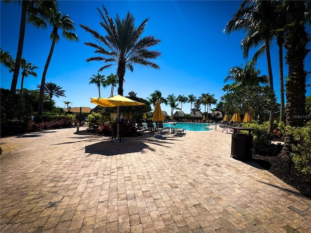 11220 Paseo Grande Blvd Unit 5207, Fort Myers, FL 33912 - community pool featuring a patio area