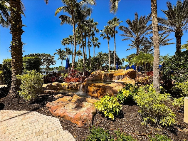 11220 Paseo Grande Blvd Unit 5207, Fort Myers, FL 33912 - view of yard featuring a garden pond