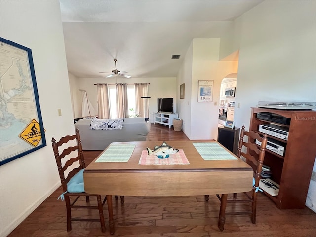 2526 Brazilia Ct, Punta Gorda, FL 33950 - dining space with arched walkways, vaulted ceiling, wood finished floors, and a ceiling fan