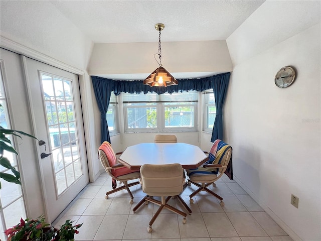 2526 Brazilia Ct, Punta Gorda, FL 33950 - dining area with light tile patterned flooring and lofted ceiling