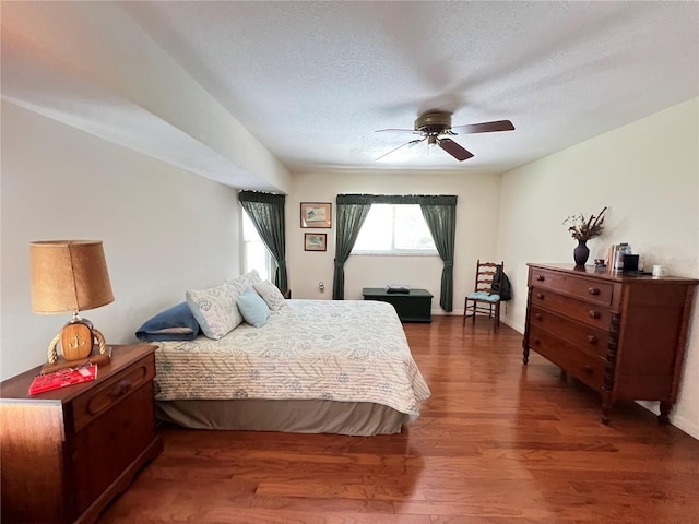 2526 Brazilia Ct, Punta Gorda, FL 33950 - bedroom featuring wood finished floors, a textured ceiling, and a ceiling fan