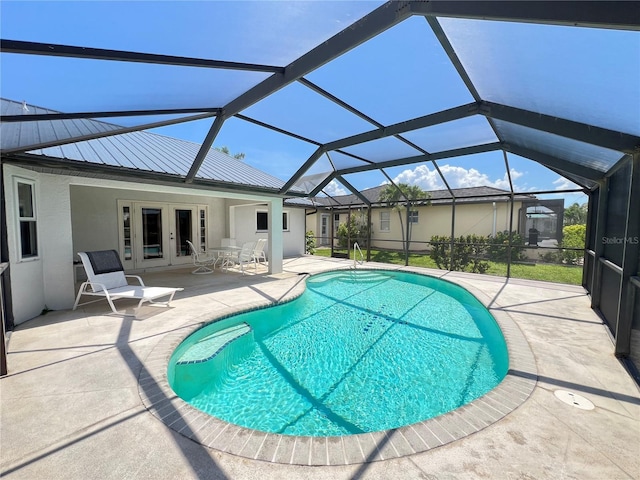 2526 Brazilia Ct, Punta Gorda, FL 33950 - outdoor pool with french doors, a patio area, and a lanai
