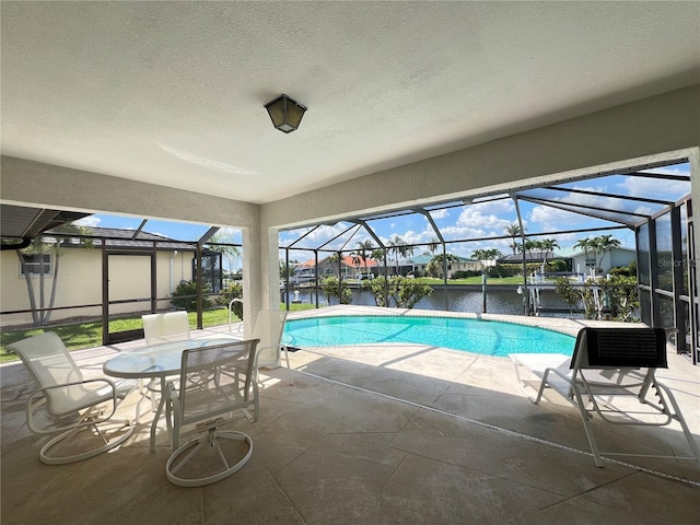 2526 Brazilia Ct, Punta Gorda, FL 33950 - swimming pool with a patio, glass enclosure, and a water view