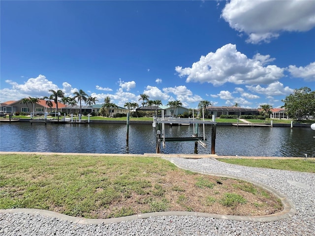 2526 Brazilia Ct, Punta Gorda, FL 33950 - dock featuring a residential view, a water view, and a yard